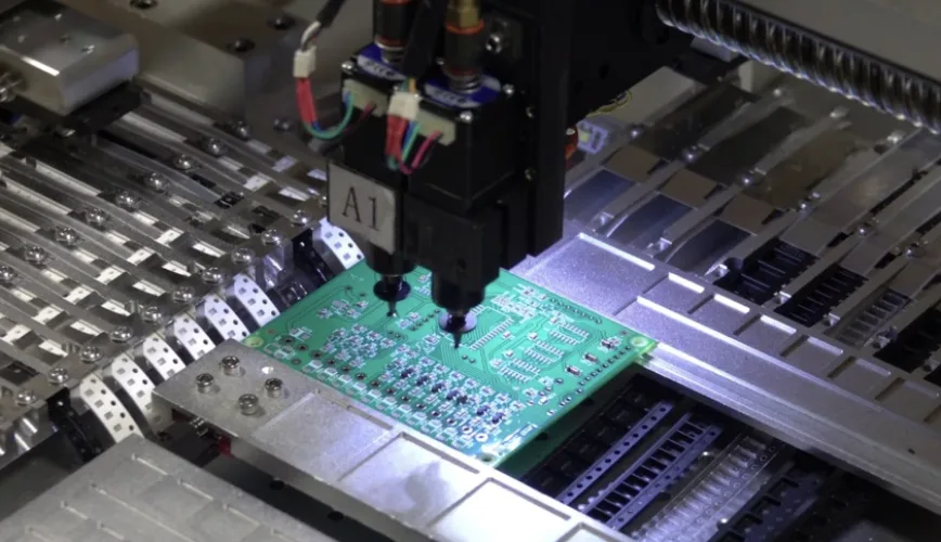 Operators working on an SMT assembly line with inline inspection